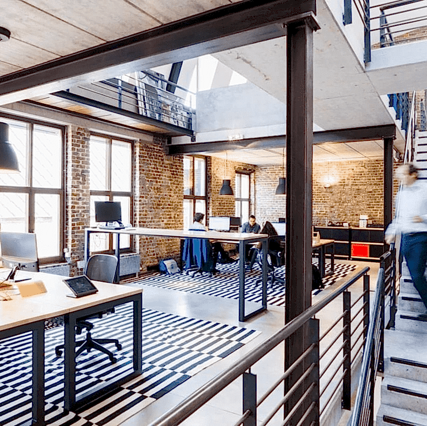 Modern loft office with exposed brick and contemporary design