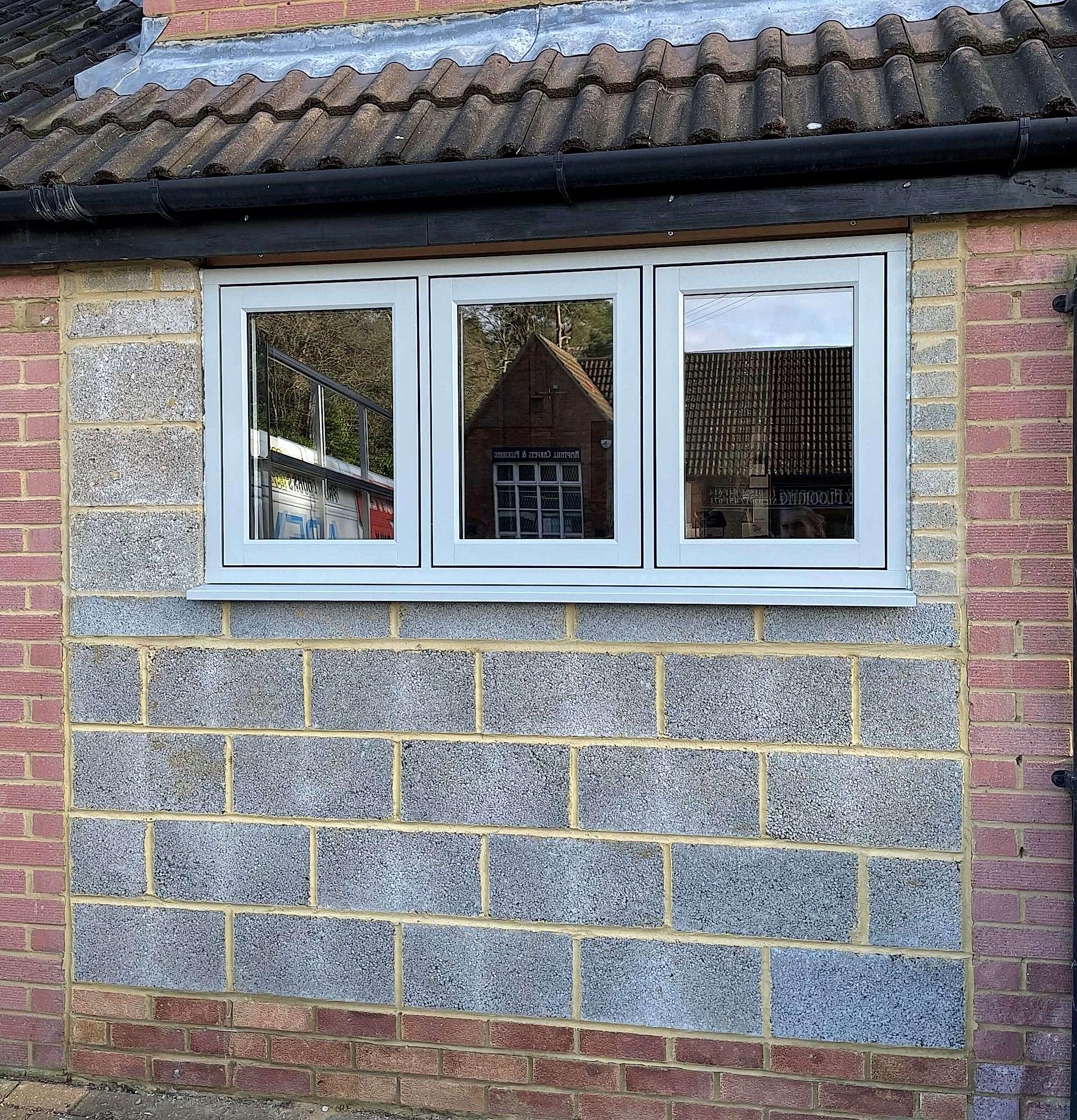 Modern office with large windows, sleek furnishings, vibrant vibe